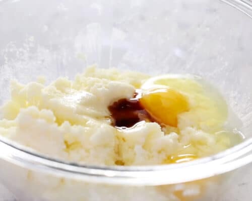 beating butter, sugar and egg in bowl