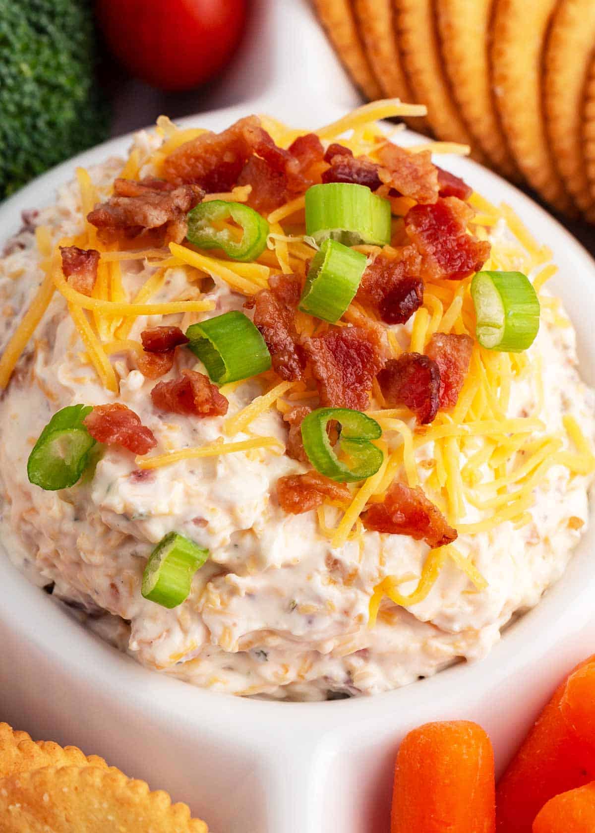 Bacon ranch dip in a white bowl.