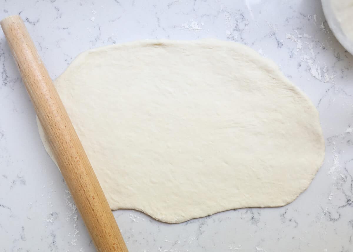 rolling out dough on counter