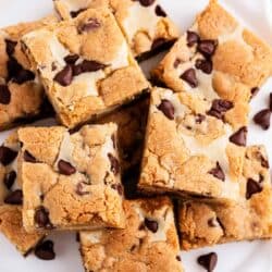 cheesecake cookie bars stacked on plate