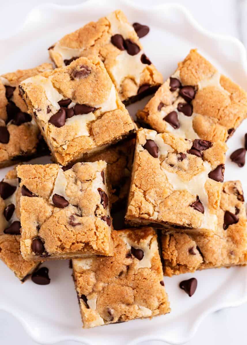 cheesecake cookie bars stacked on plate