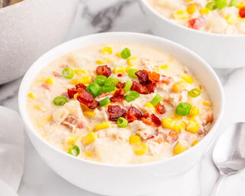 chicken and corn chowder in white bowl