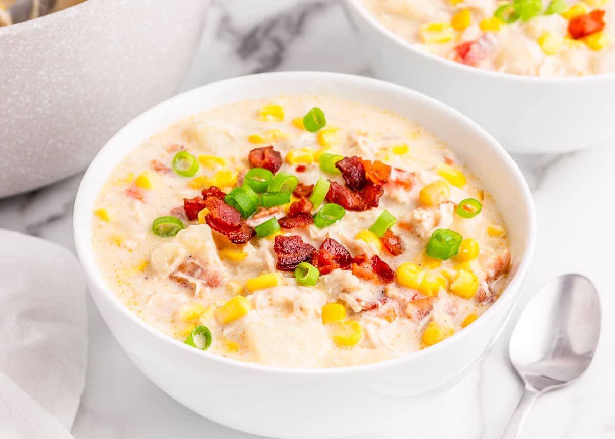 chicken and corn chowder in white bowl