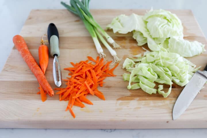 chopping vegetables on wooden board
