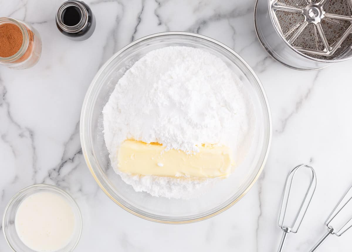 butter and powdered sugar in bowl