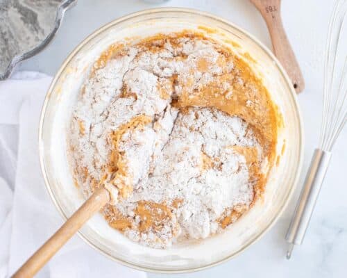 mixing pumpkin and flour in bowl