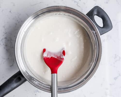 mixing wet play dough in pan