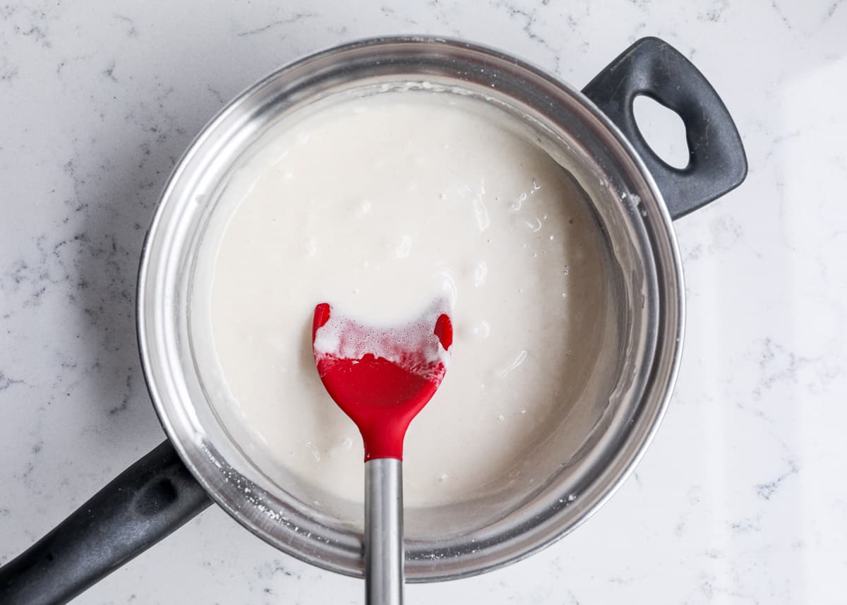 mixing wet play dough in pan