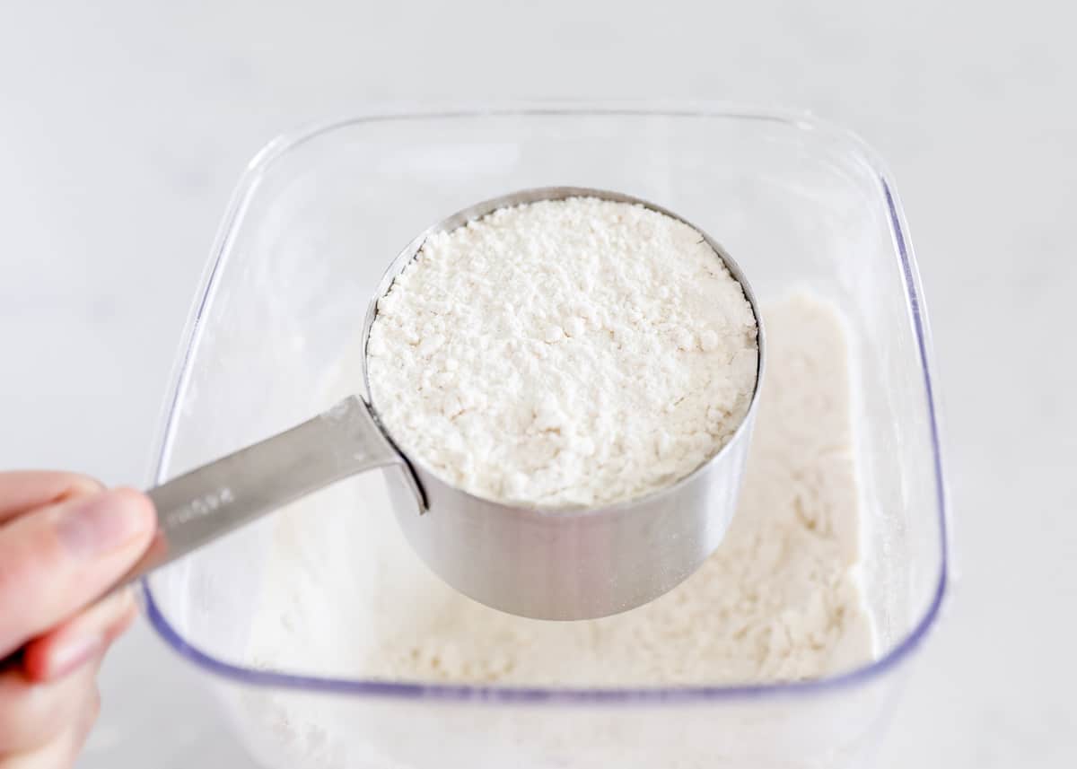 shaking flour off the measuring cup