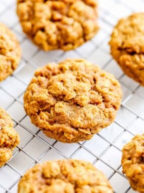 Pumpkin oatmeal cookies cooling on a wire cookie rack.