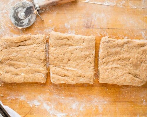cutting dough on cutting board