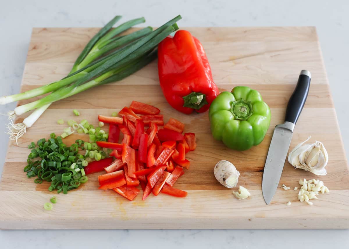 cutting vegetables on wooden board