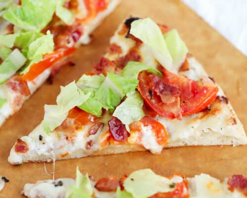 Slice of BLT pizza on pizza peel