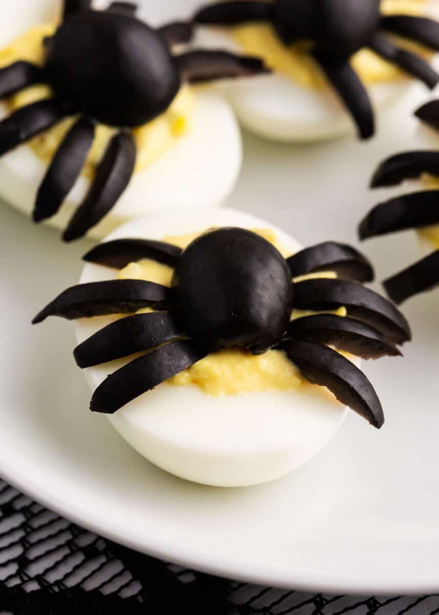 spider deviled egg on white plate
