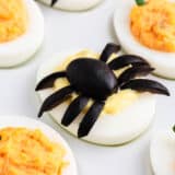 Halloween deviled eggs on white plate