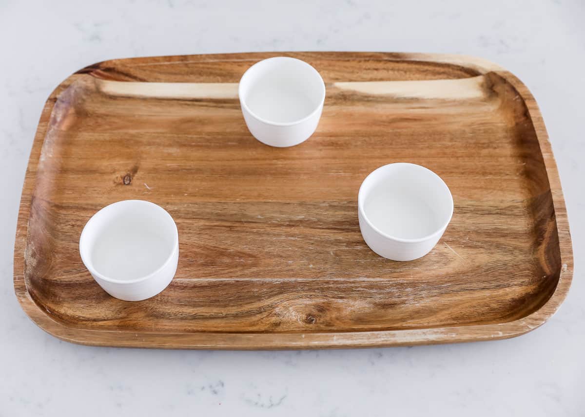 board with white bowls on top