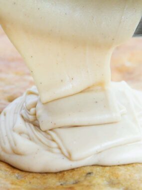 pouring brown butter frosting