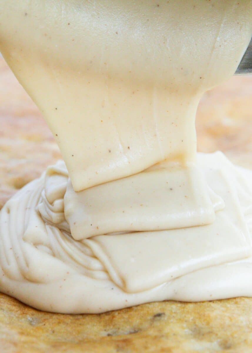 pouring brown butter frosting