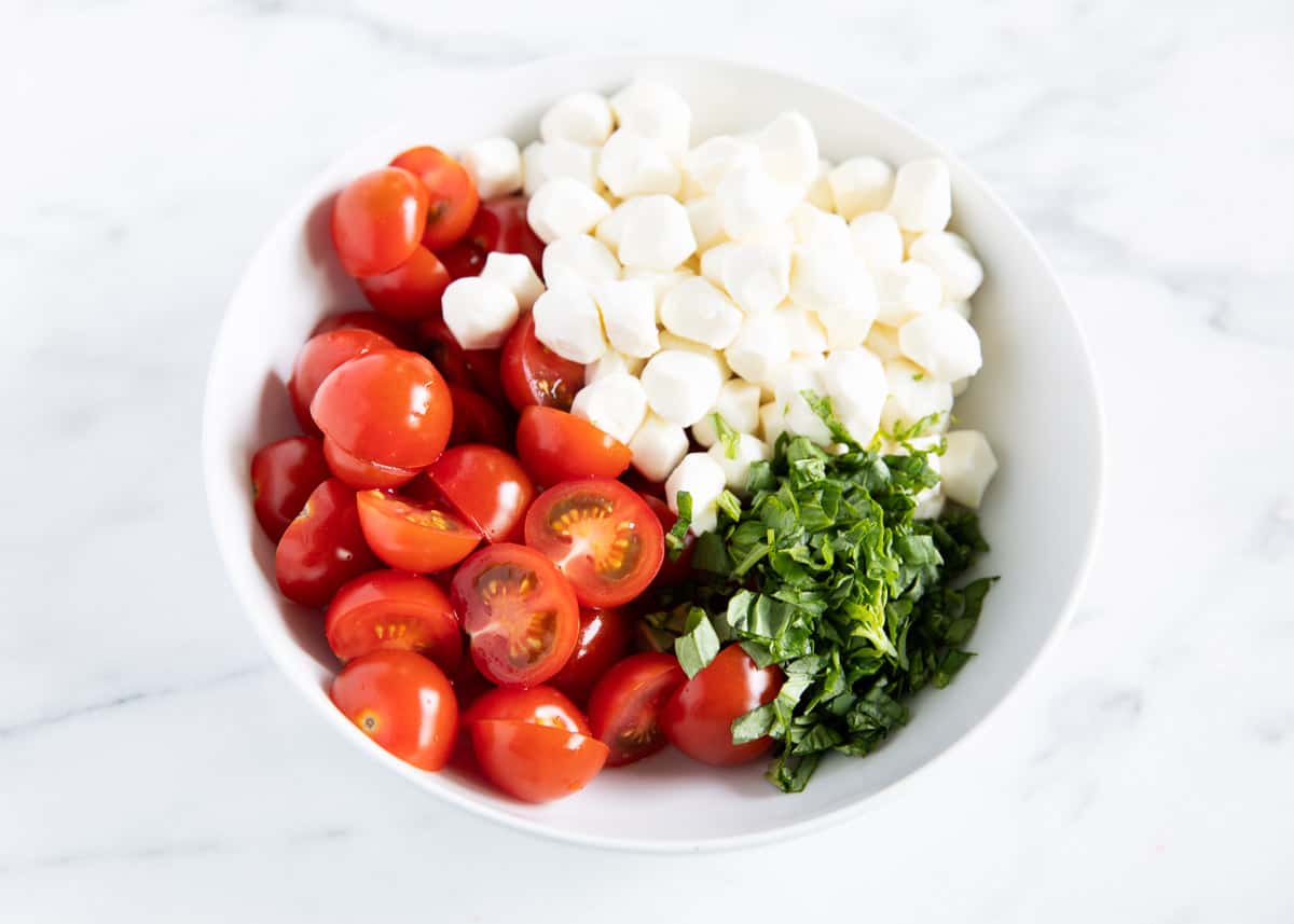 tomatoes, basil and mozzarella in bowl