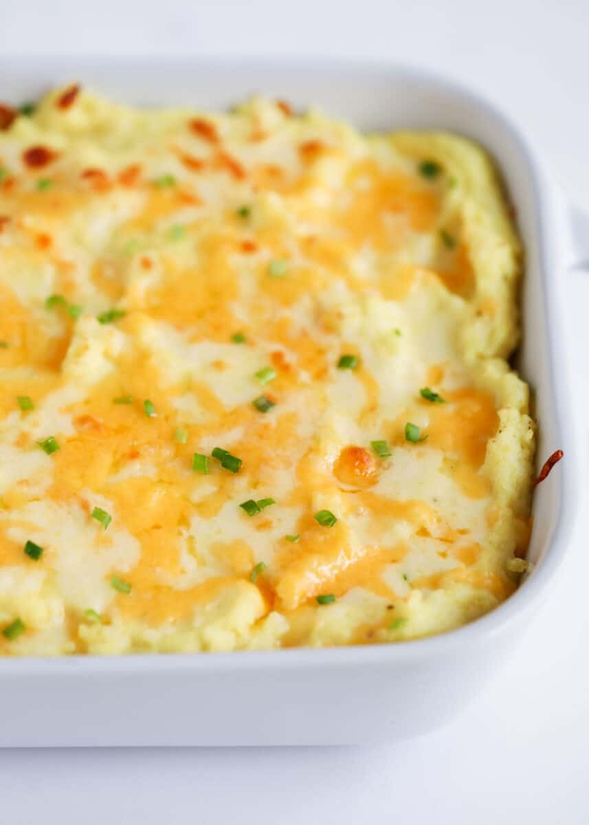 cheesy potatoes in white dish