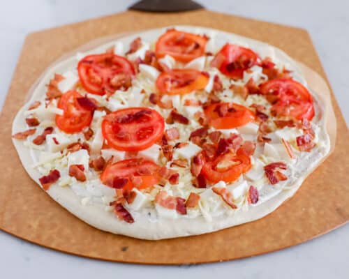 chicken bacon ranch pizza on pizza peel