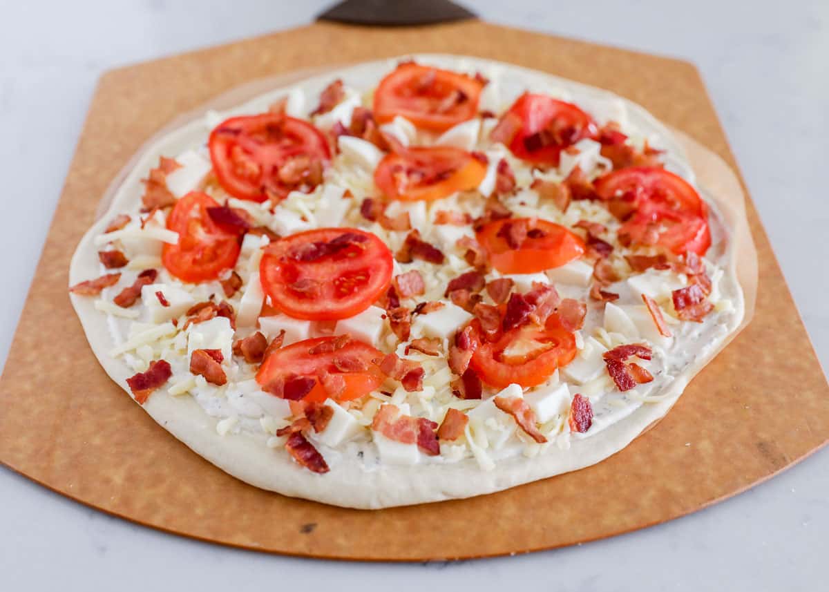 chicken bacon ranch pizza on pizza peel