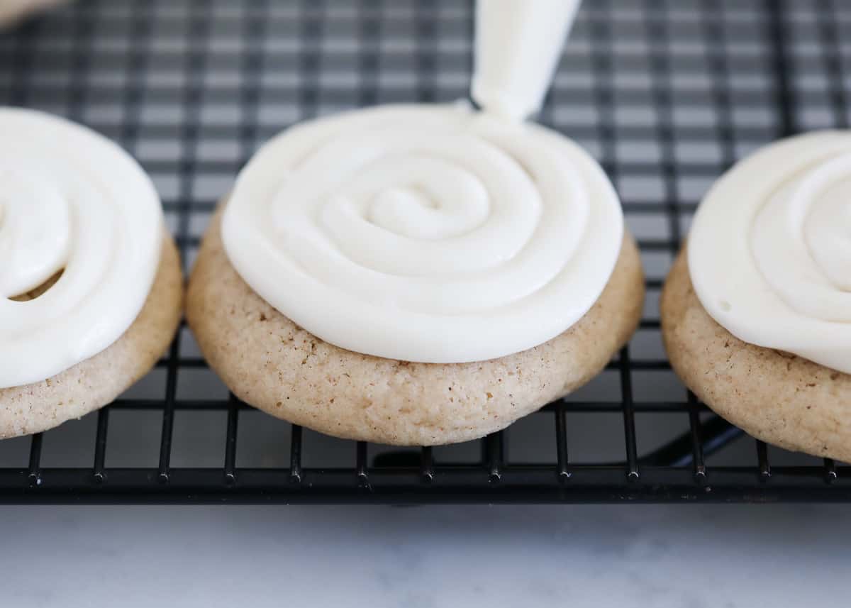frosting cookies on cooling rack