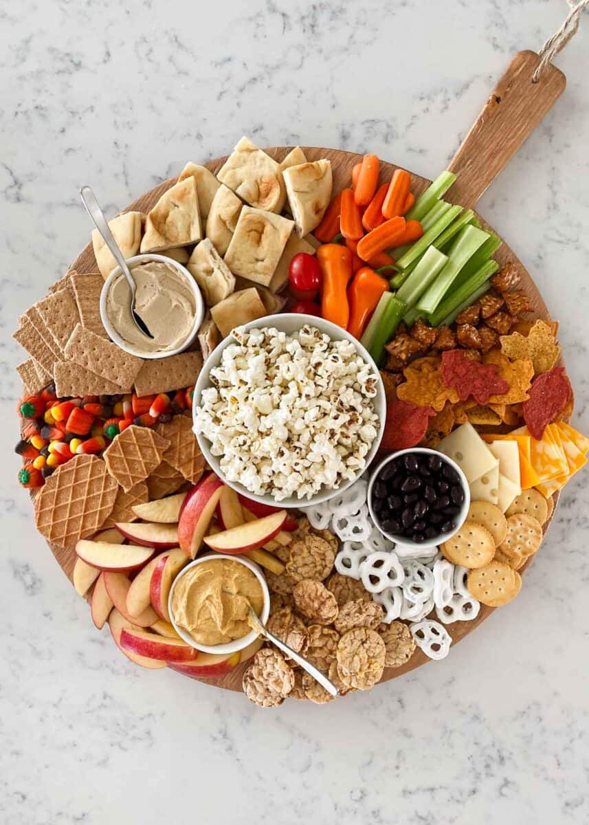 fall charcuterie board on wooden circle board