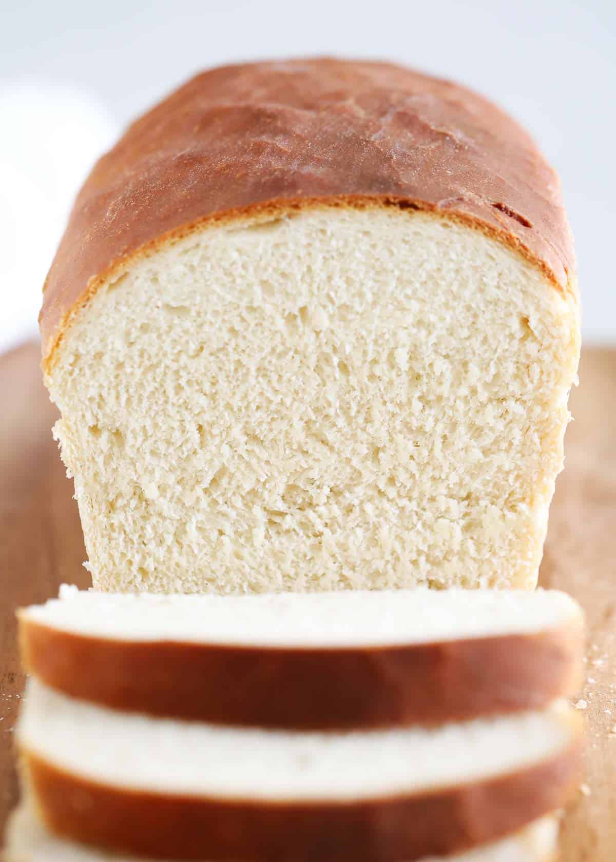 sliced bread loaf on cutting board