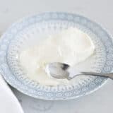 cream cheese on blue and white plate