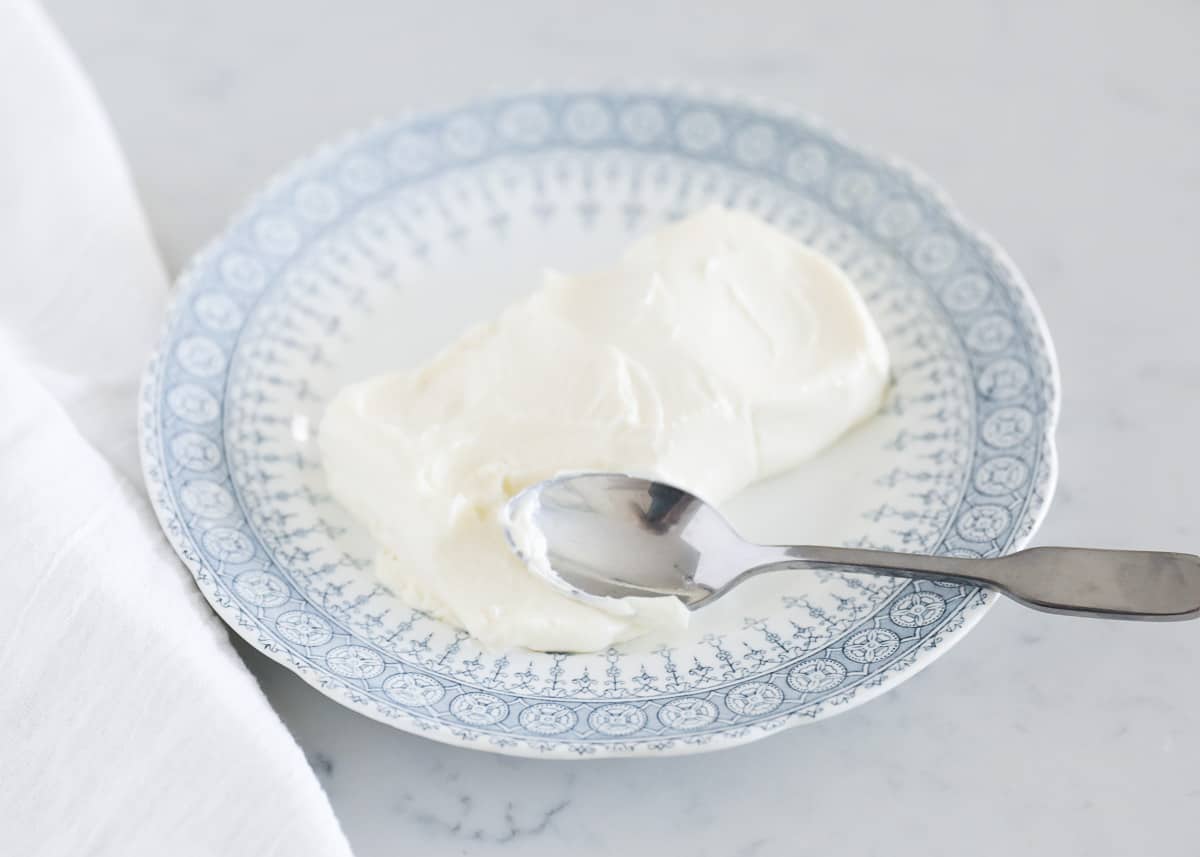 cream cheese on blue and white plate