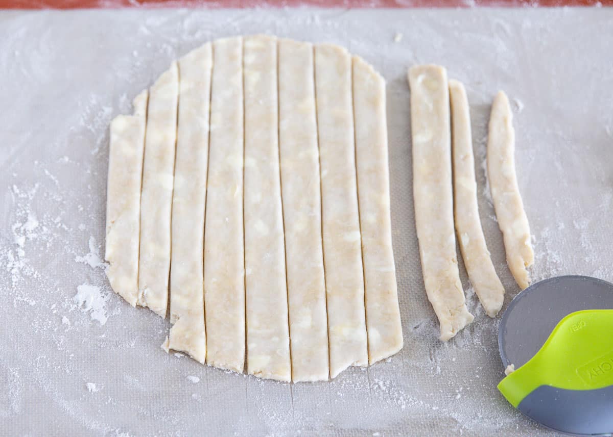 cutting pie crust on mat