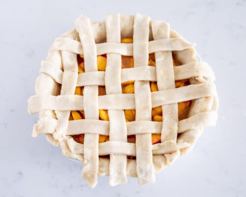 lattice pie crust on top of peach pie