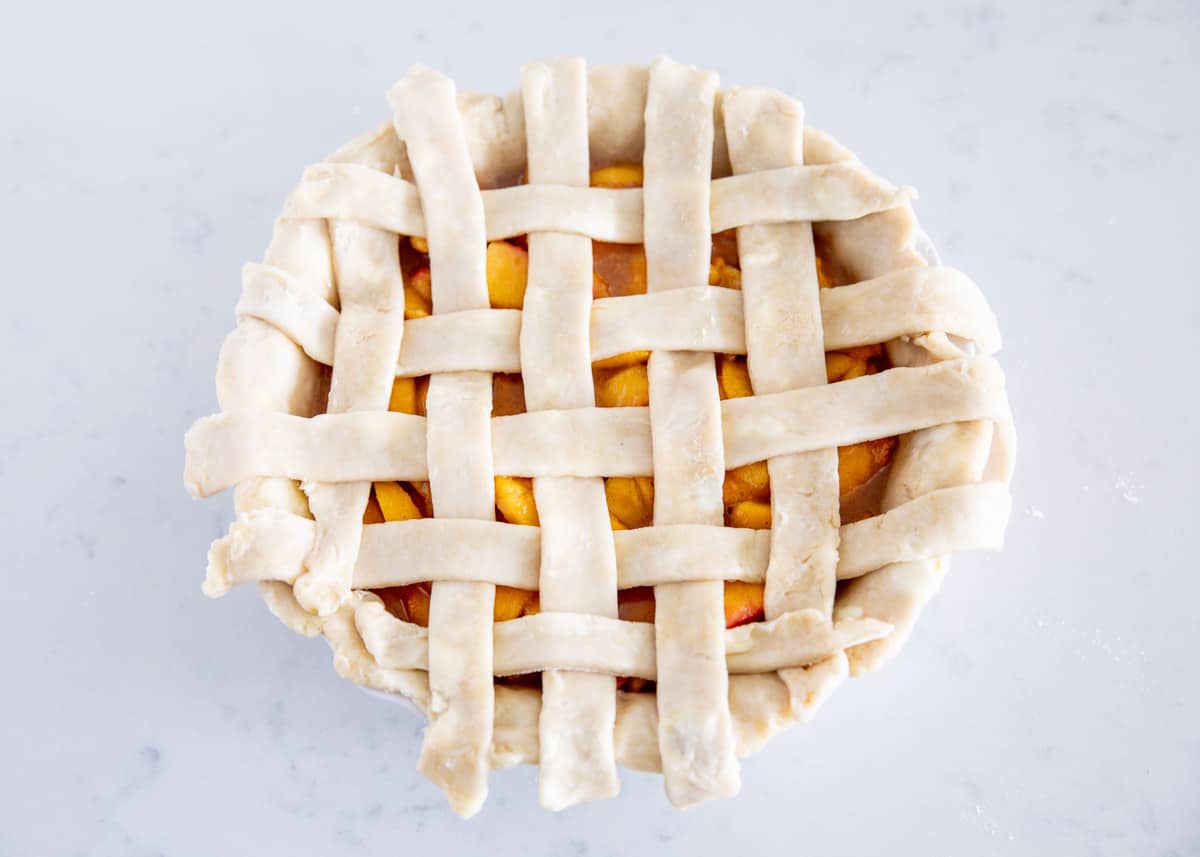 lattice pie crust on top of peach pie