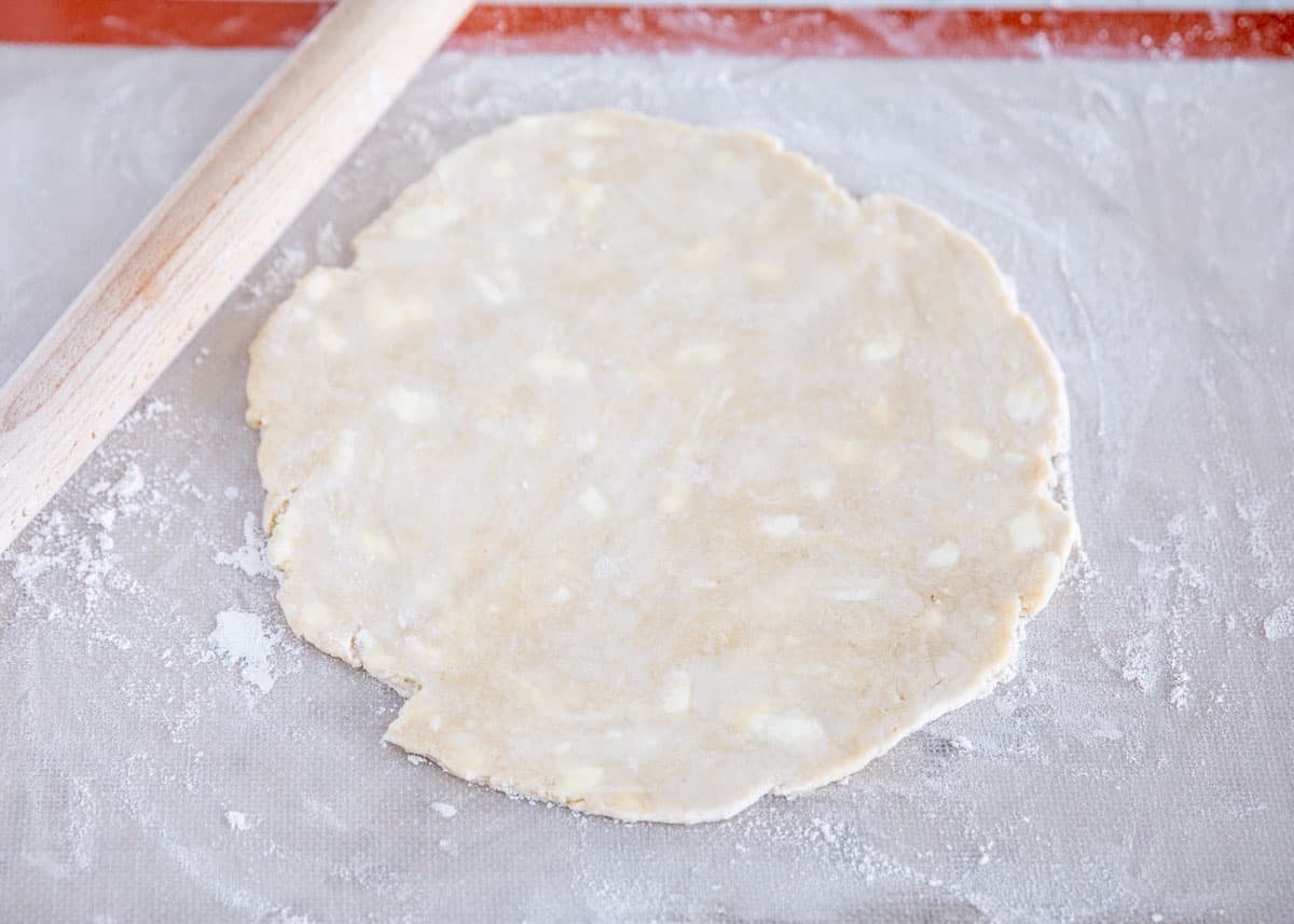 pie crust being rolled out on counter