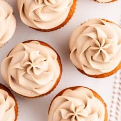maple cream cheese frosting on top of cupcakes