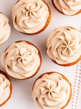 maple cream cheese frosting on top of cupcakes