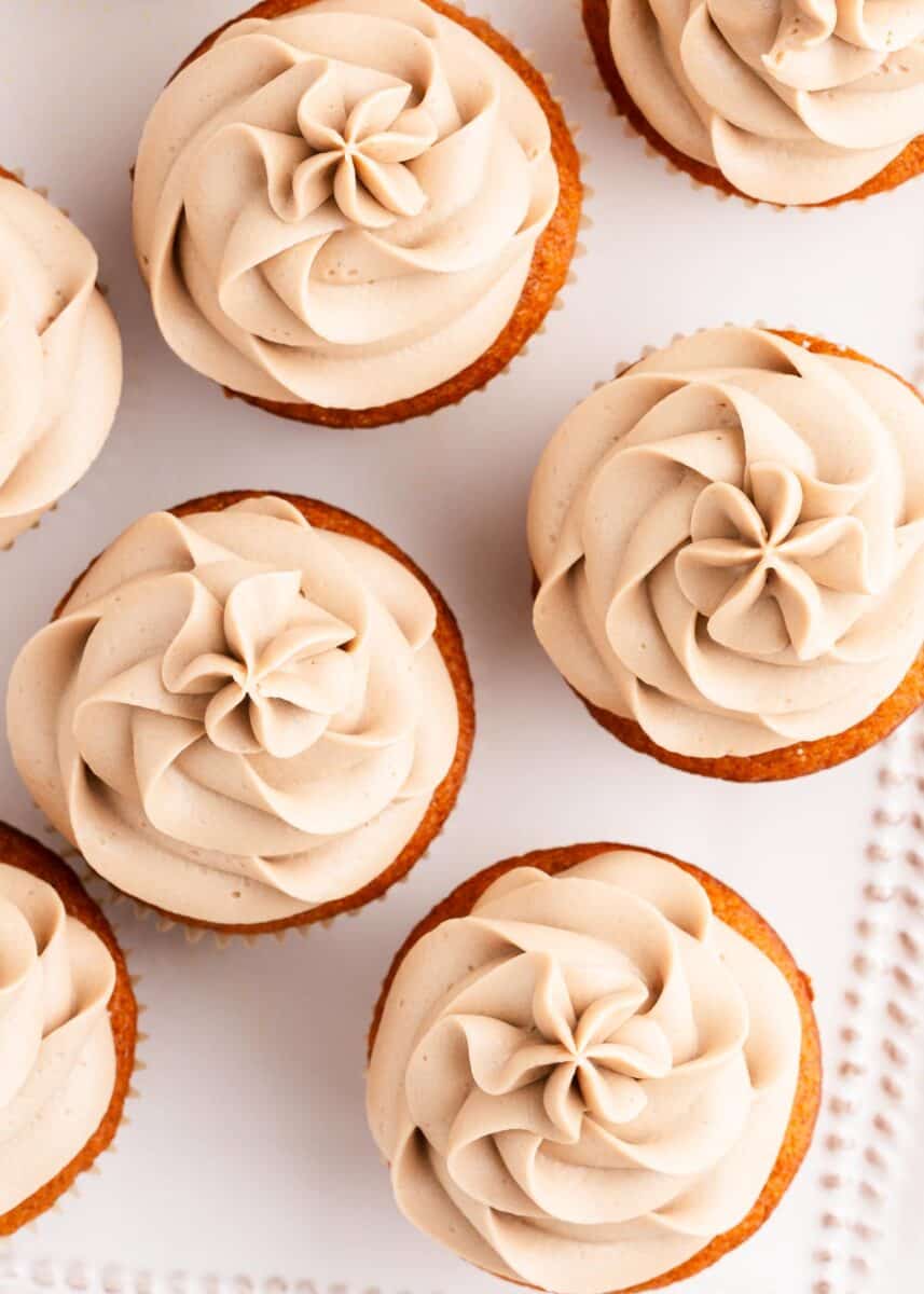 maple cream cheese frosting on top of cupcakes