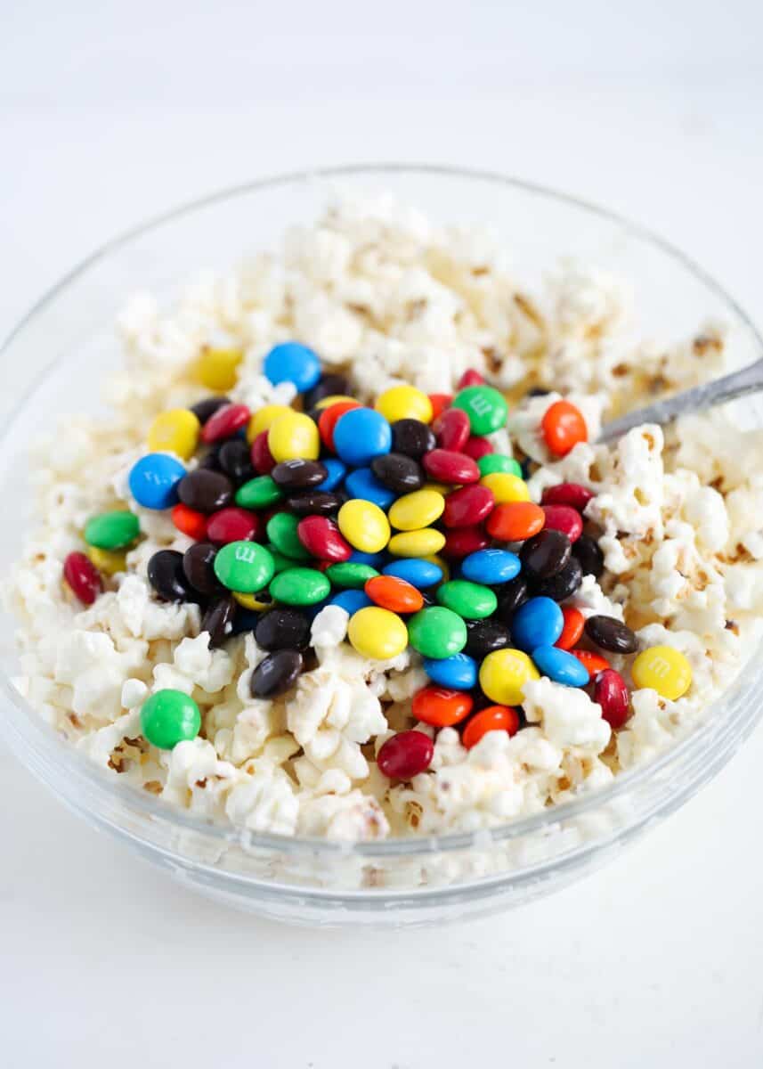 popcorn and m&m's in glass bowl