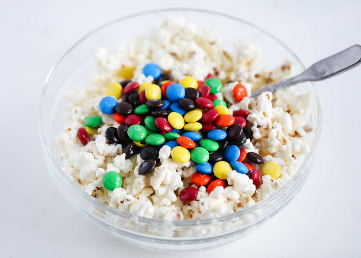 popcorn and m&m's in glass bowl