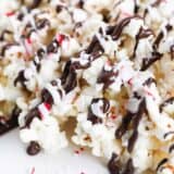 peppermint bark popcorn with chocolate drizzle