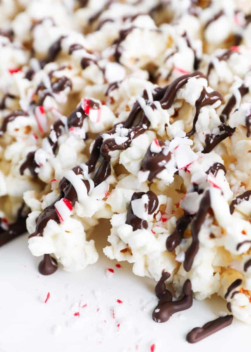 peppermint bark popcorn with chocolate drizzle