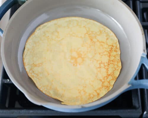 cooking pumpkin crepes in pan