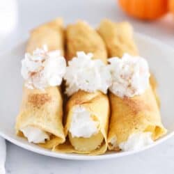 rolled pumpkin crepes with whipped cream