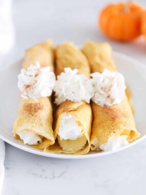 rolled pumpkin crepes with whipped cream