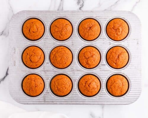 pumpkin cupcakes in muffin pan