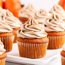 frosted pumpkin cupcakes on plate