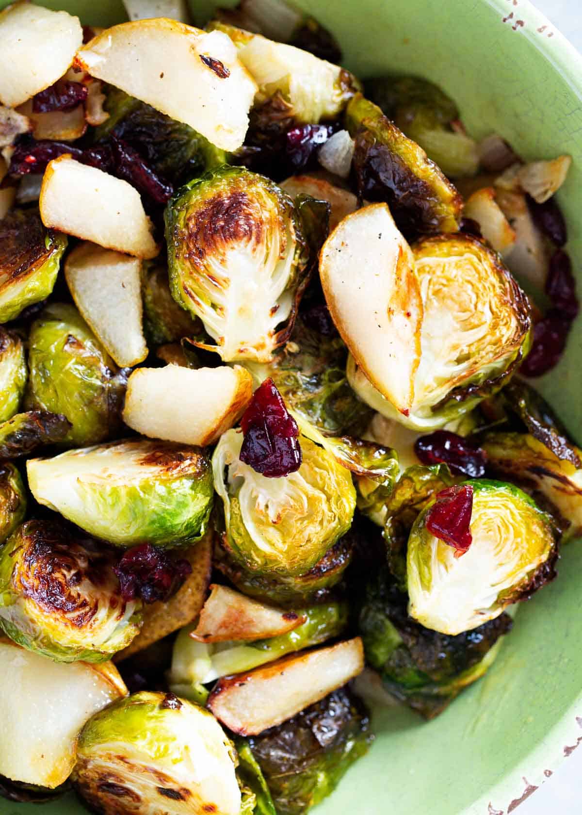 Roasted brussel sprouts with cranberries in bowl.
