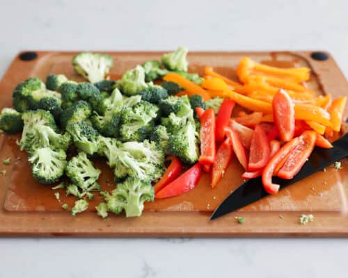 cutting vegetables on wooden cutting board