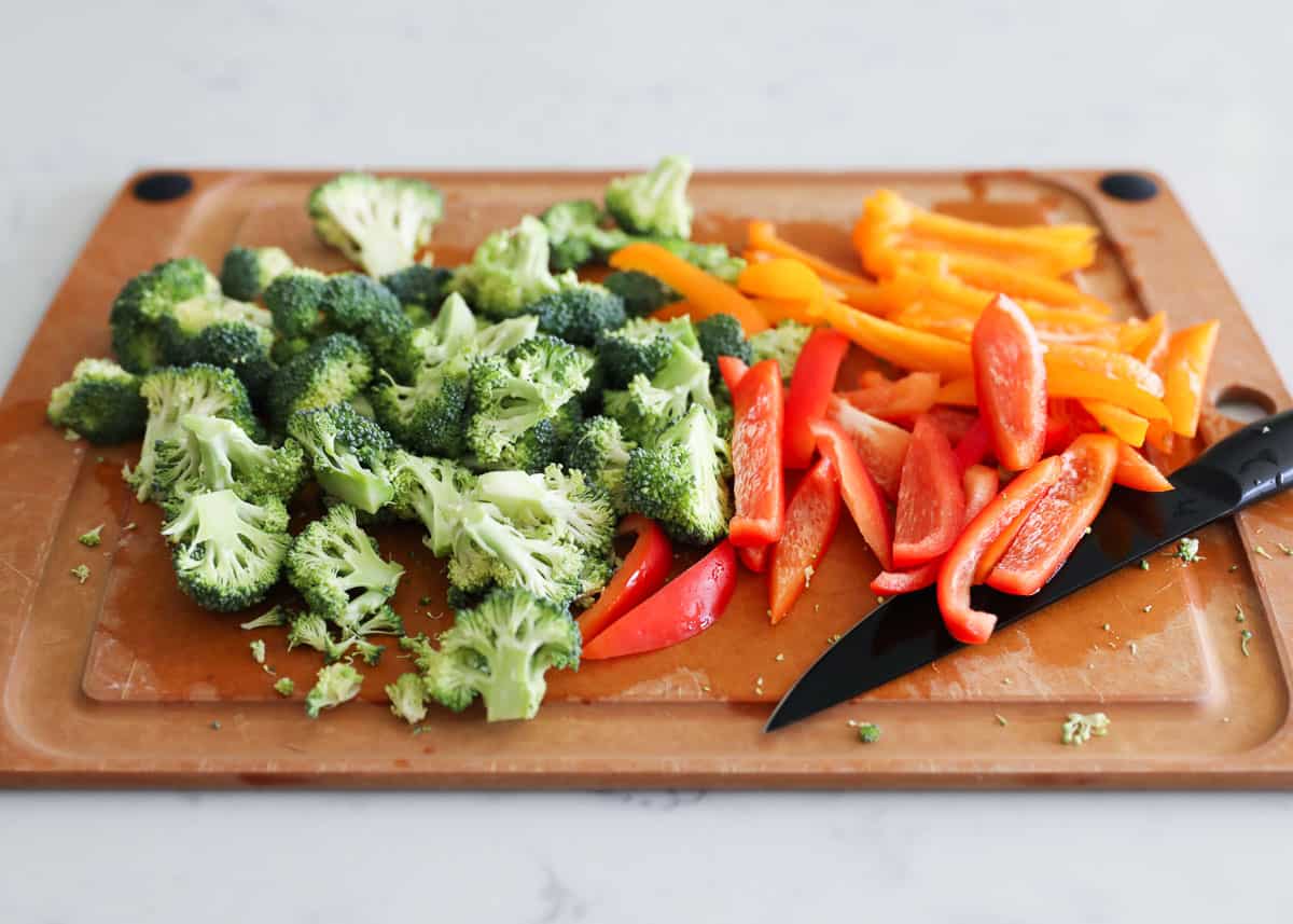 cutting vegetables on wooden cutting board